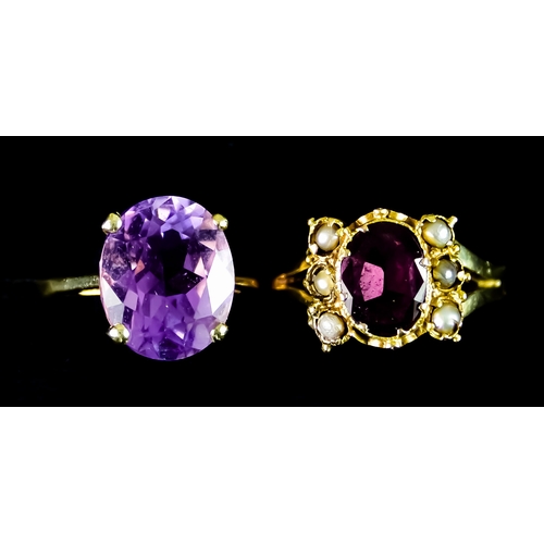 611 - Two 9ct Gold Amethyst Rings, comprising - one oval amethyst stone flanked either side by three small... 