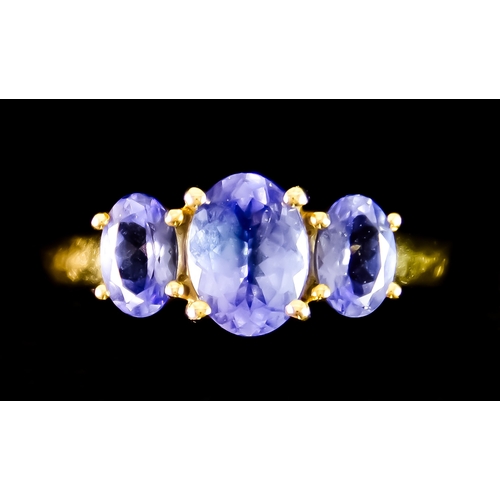 614 - A 9ct Gold Three Stone Tanzanite Ring, set with three oval faceted tanzanite stones, of approximatel... 
