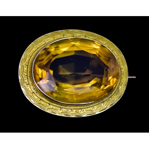 617 - A Gold Coloured Metal Brooch, set with large faceted citrine stone, 25mm x 22mm, total gross weight ... 