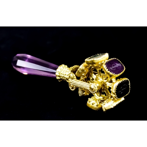 619 - A Semi-Precious Gem Set Gilt Metal Revolving Seal, comprising - seven revolving seals each being a d... 