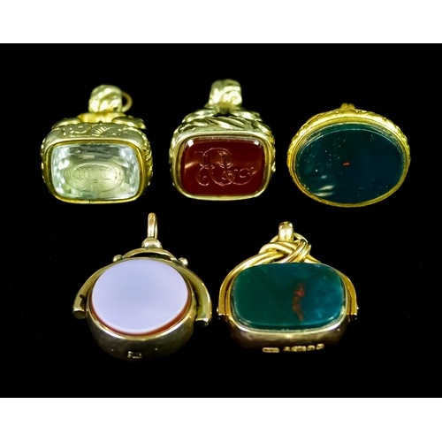 646 - A Quantity of Seals, comprising - two 9ct gold set with bloodstone spinning seals, gross weight 17.8... 