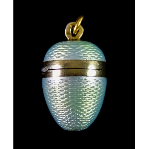 648 - A Silver Gilt Continental Guilloche Pendant in the form of an egg, with hinged opening top, approxim... 