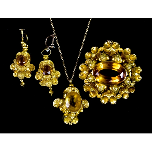 653 - A Gilt Metal Suite of Gem Set Jewellery, comprising - brooch, earrings for non-pierced ears, and pen... 