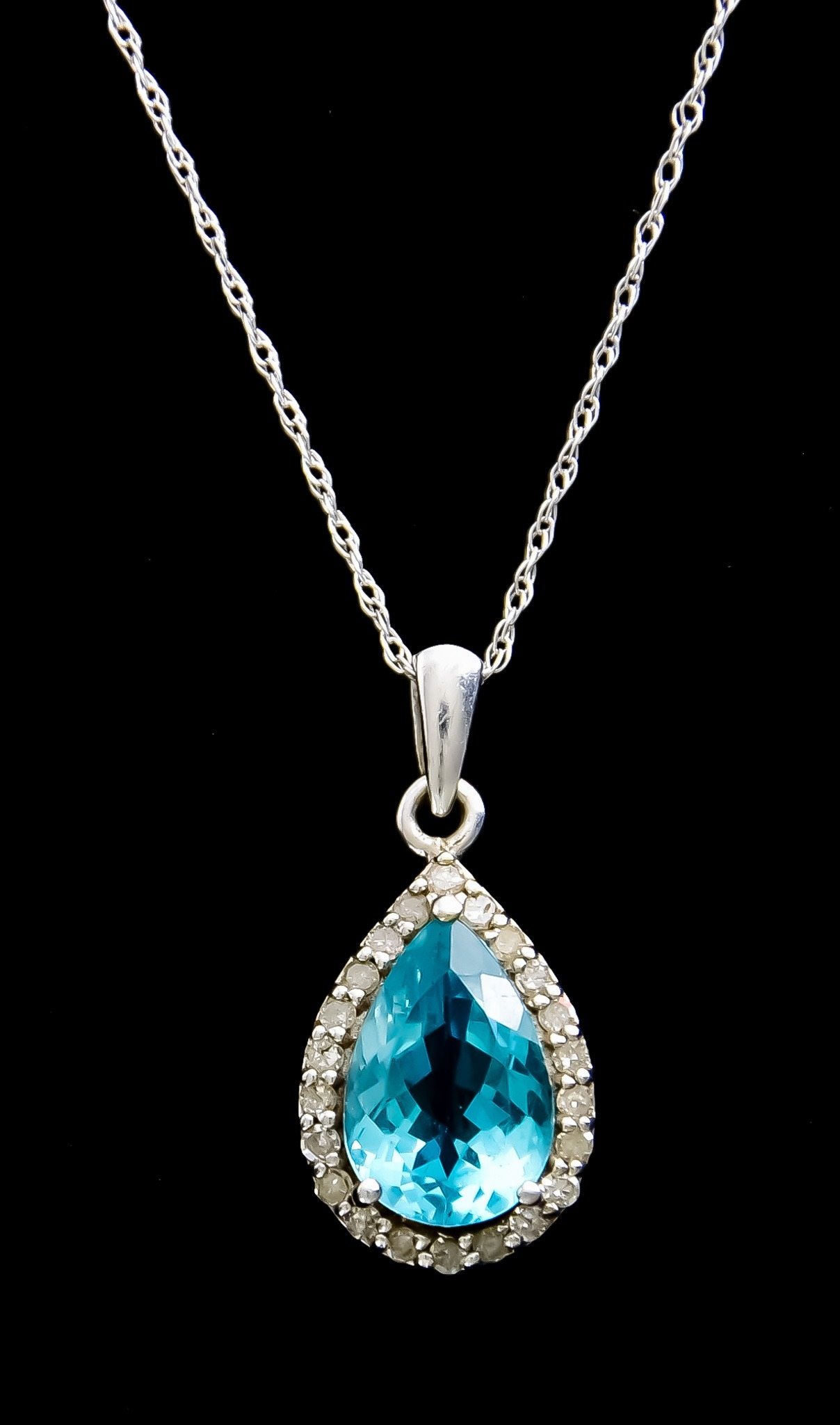 A 9ct White Gold Topaz Necklace, pendant set with a tear drop faceted ...
