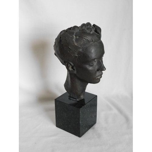 Bronze cast head of a female on a marble base by renowned sculptor