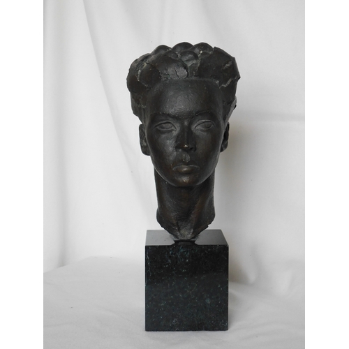 Bronze cast head of a female on a marble base by renowned sculptor