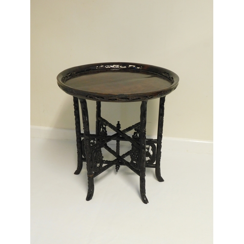 194 - Hardwood Chinese carved folding table
-diameter 52cm (20½