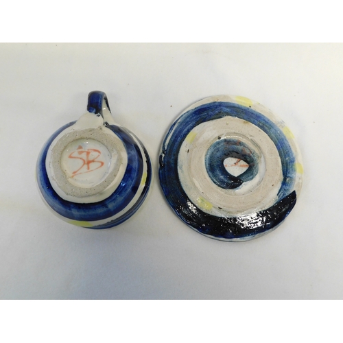 216 - Studio pottery cup and saucer by Sandy Brown
-saucer diameter 17cm (6¾