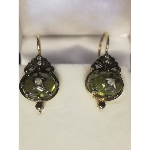17 - Pair of drop earrings set with cabochon peridot and diamonds
