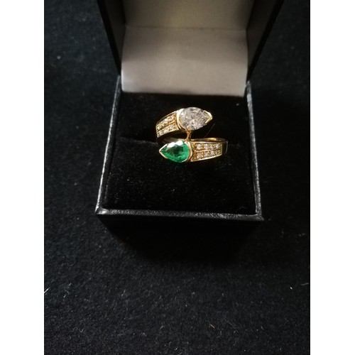 31 - Emerald and Diamond pear shaped stones crossover ring