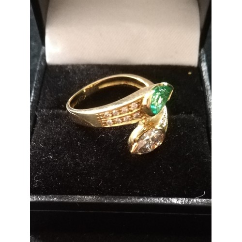 31 - Emerald and Diamond pear shaped stones crossover ring
