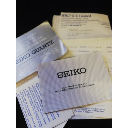 42 - Seiko quatz alarm chronograph watch with papers and booklet 1993