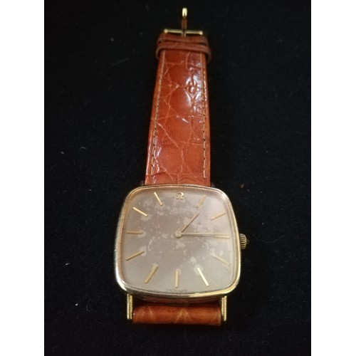 63 - Omega de ville 9ct gold cased wristwatch on leather strap
-faded dial & in running order