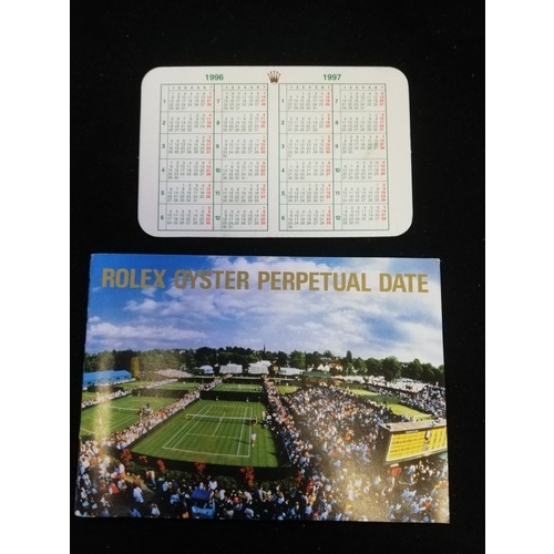 76 - Rolex oyster perpetual date booklet & calendar card dated 1997