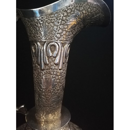 88 - Persian white metal ewer with engraved decoration to body
-tested as silver
-weight 836g (26.8oz)