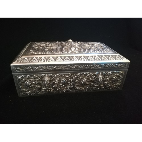 90 - Asian silver embossed cigarette box with wood interior
-8¼