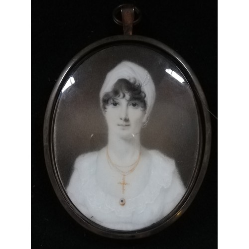 109 - Portrait miniature of a lady on ivory in a locket frame with hair to back & initials DAE in a later ... 