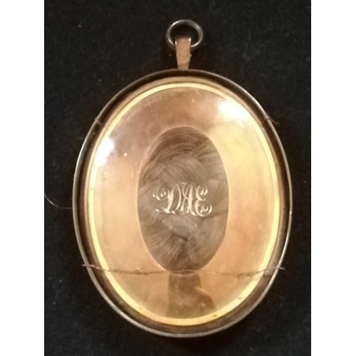 109 - Portrait miniature of a lady on ivory in a locket frame with hair to back & initials DAE in a later ... 