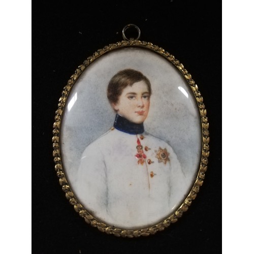 110 - Portrait miniature on ivory of a young gentleman - royalty? in a gilt brass oval frame with a laurel... 
