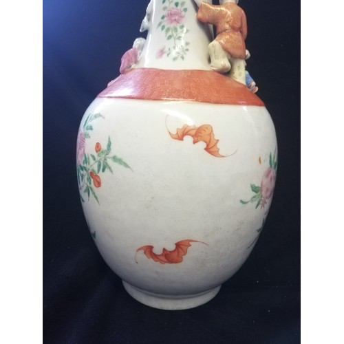 136 - Chinese floral decorated vase with applied clambering boys - with obvious damage & marks obliterated... 