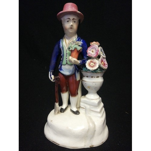 167 - Early pottery figure of a gardener