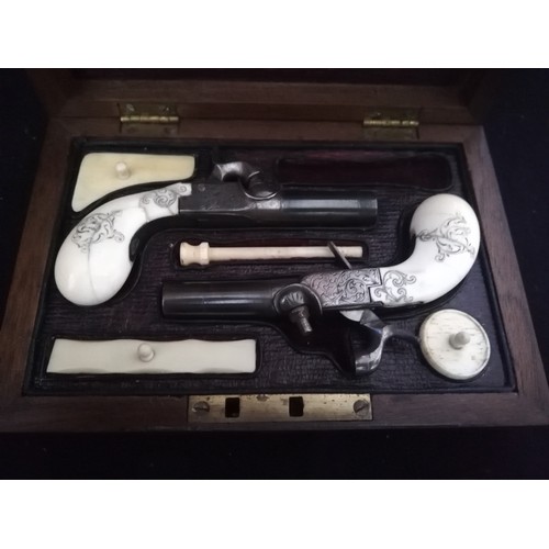 189 - Cased pair of antique percussion pistols with ivory grips & hand chased decoration
-guns 4