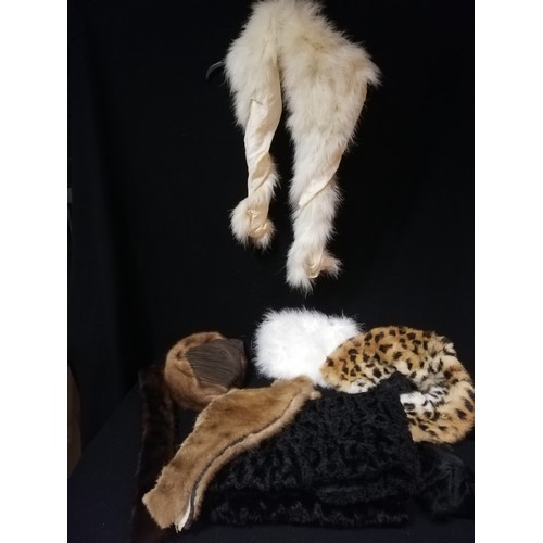 299 - Quantity of fur items inc muff hats & collars