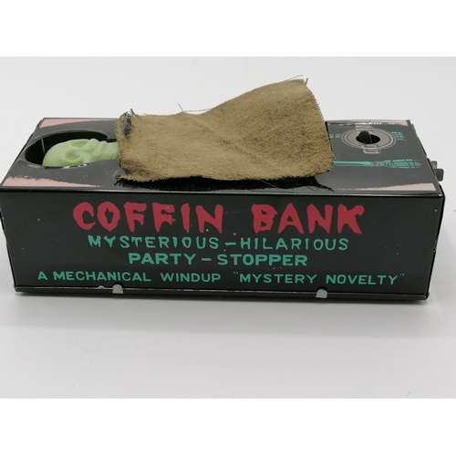 25 - Clockwork coffin moneybox by Yone (Japan)