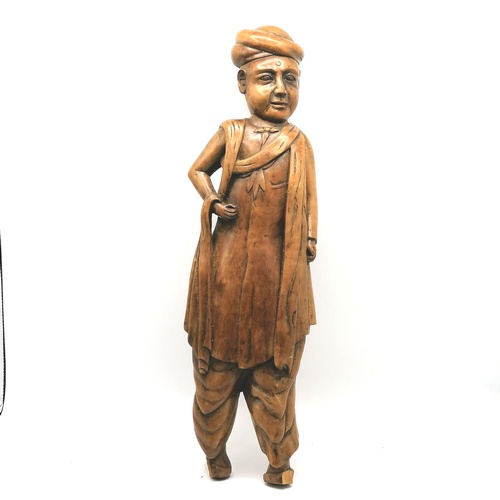 91 - Hand carved Indian male figure detached from base - figure height 19