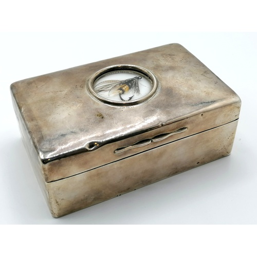 133 - Novelty silver cigarette box with a salmon fly set under glass in the lid - 5½