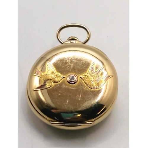 168 - Heavy gold plated ladies fob watch set with diamond to back case & 2 bird motif - running