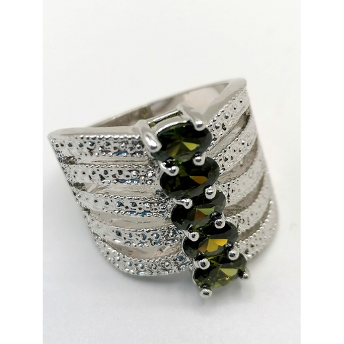 238 - 925 stamped dress ring set with 5 peridots t/w 3 other 925 rings