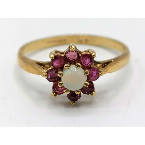 239 - 9ct gold opal & ruby ring