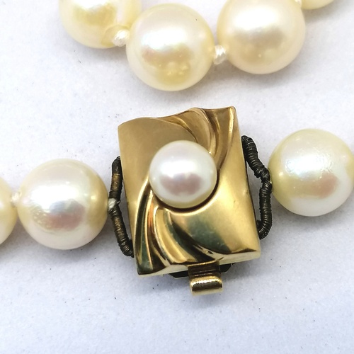 323 - pearl necklace with a 9ct and pearl clasp, 20