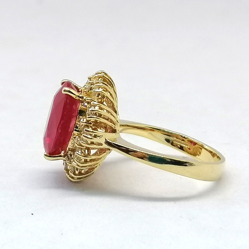 332 - 14ct diamond and large ruby cluster ring
-the ruby is approx 4.7ct & is surrounded by a total of 24 ... 