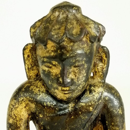 23 - Black lacquered wooden carved effigy of Buddha with gold sponged decoration - height 8