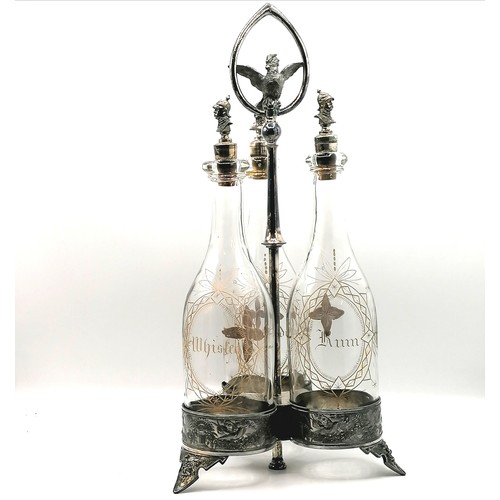 383 - Meriden Brandy / Whisky / Rum decanter set on a plated spirit bottle carrier with a parrot finial to... 