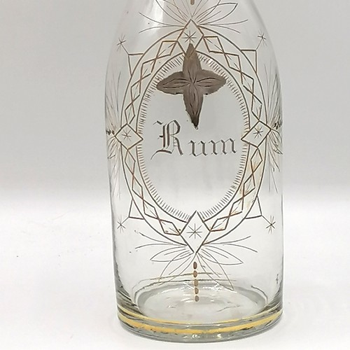 383 - Meriden Brandy / Whisky / Rum decanter set on a plated spirit bottle carrier with a parrot finial to... 