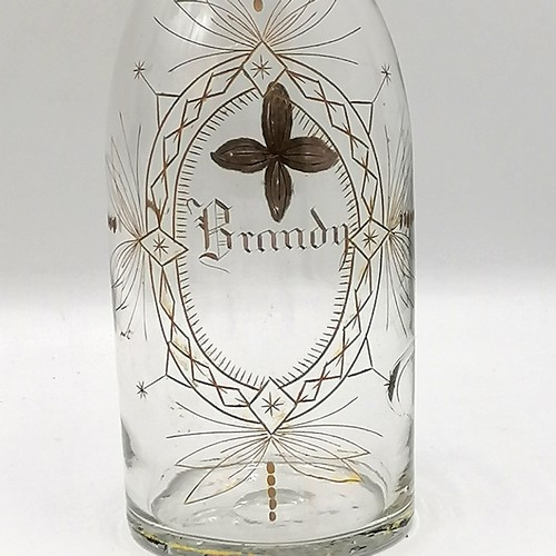 383 - Meriden Brandy / Whisky / Rum decanter set on a plated spirit bottle carrier with a parrot finial to... 