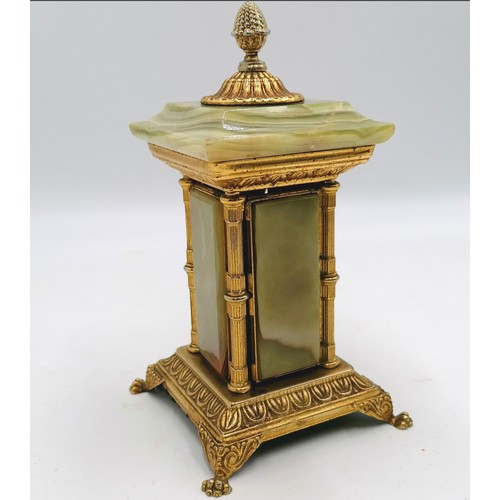 25 - Vintage onyx & ormolu table cigarette holder which opens by turning the finial - height 8½