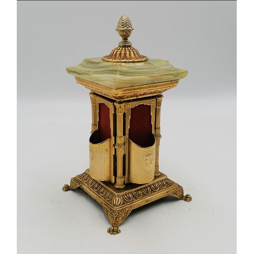 25 - Vintage onyx & ormolu table cigarette holder which opens by turning the finial - height 8½