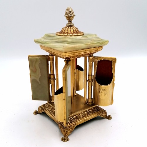 25 - Vintage onyx & ormolu table cigarette holder which opens by turning the finial - height 8½