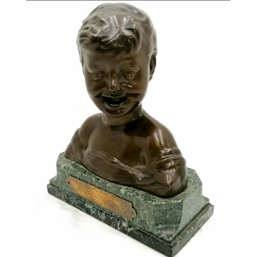 79 - Bronze bust of a laughing child with a presentation plaque to the front on a marble base signed on r... 