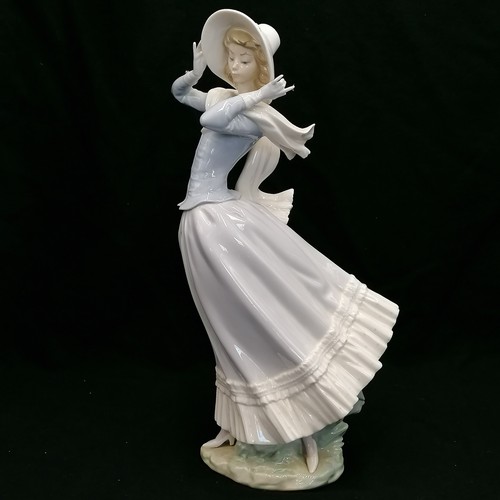 99 - Lladro large figurine of a girl wearing a hat - height 14