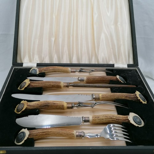 104 - John Taylor & Co 7 piece carving set with antler handles & stag medallions to the ends of the handle... 