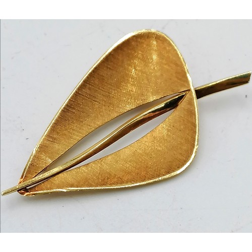 192 - 18ct gold marked leaf shaped brooch (7.5g) t/w a costume brooch (catch a/f)