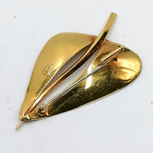 192 - 18ct gold marked leaf shaped brooch (7.5g) t/w a costume brooch (catch a/f)