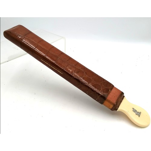 320 - Crocodile cased ivory handled strop with silver inlaid crest to handle - 14