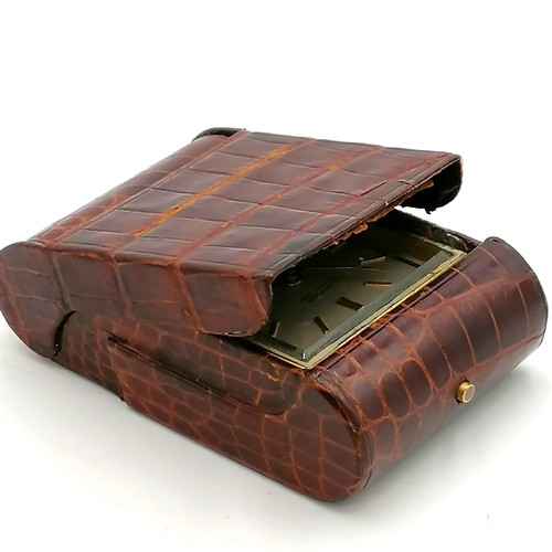 327 - Looping 8 day travel alarm clock in a crocodile leather case - ticking