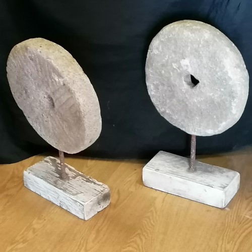 648 - pair of concrete circular millstones mounted on wooden bases - 20